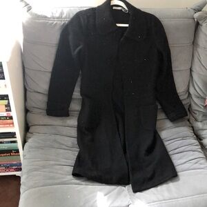 black wool knee length coat with stitching details